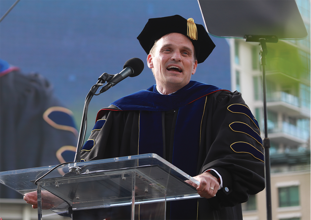 faculty member at podium